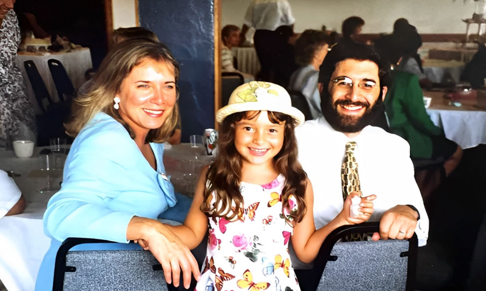 In 1997, an image captures Jonathan Sugarman alongside his wife Terese and their daughter Maya.