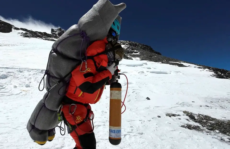 A Nepali Sherpa, 30 years old, Gelje Sherpa rescues a freezing Malaysian climber in a very rare high-altitude rescue from Mt. Everest.